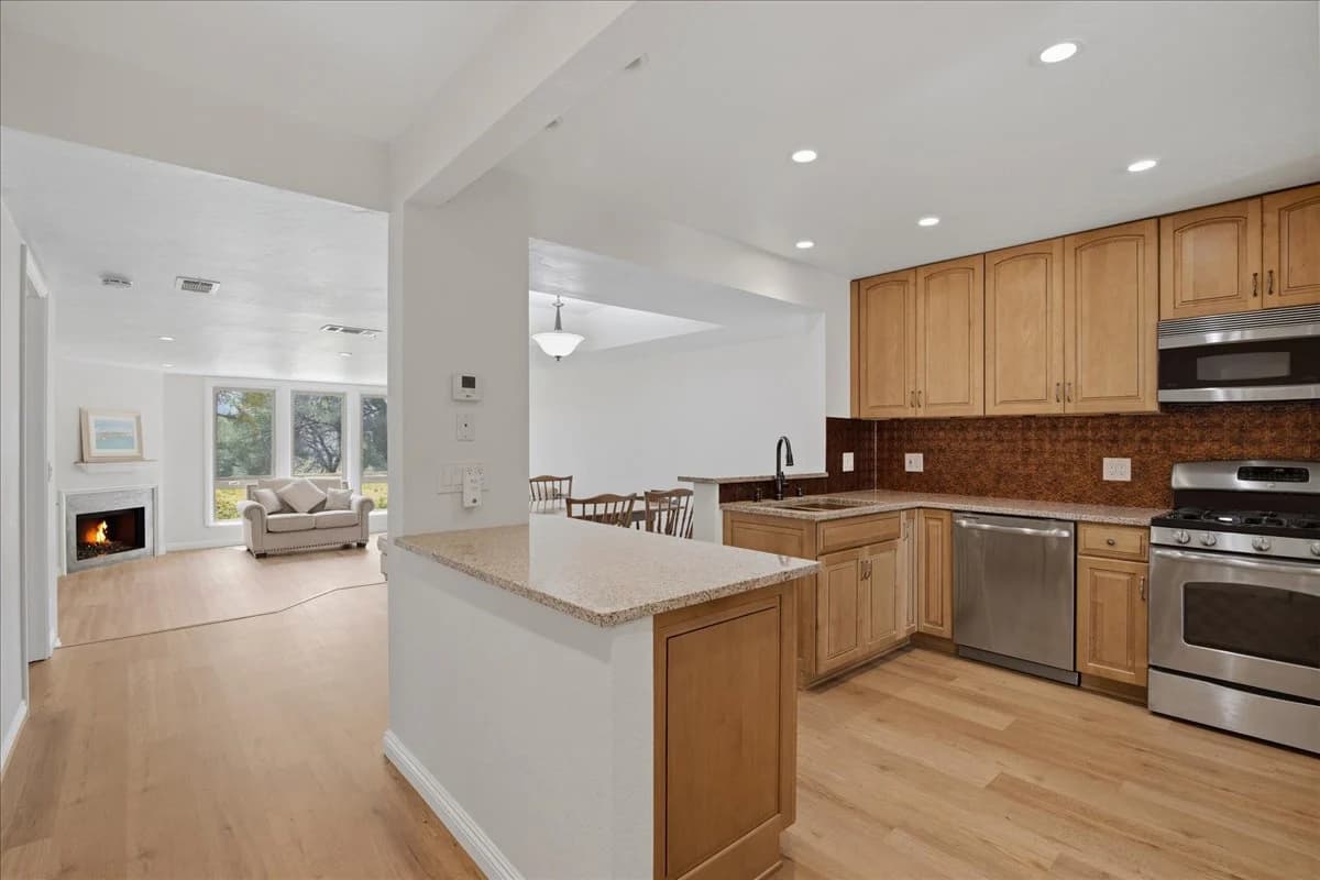 Past Auld Castle real estate sale — white clapboard home with brick driveway